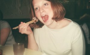 21-year-old me in Taiwan, May 2001, pretending to eat a raw baby octopus. It's not a frog, but you get the idea.  